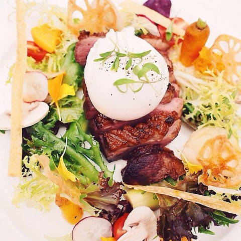 Edible garden with roasted French duck and poached egg