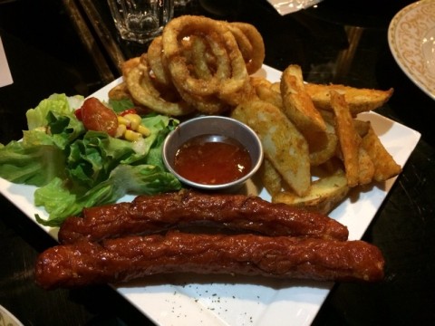 of wedges, salad, onion rings and garlic sausages . Sausage tad salty 
