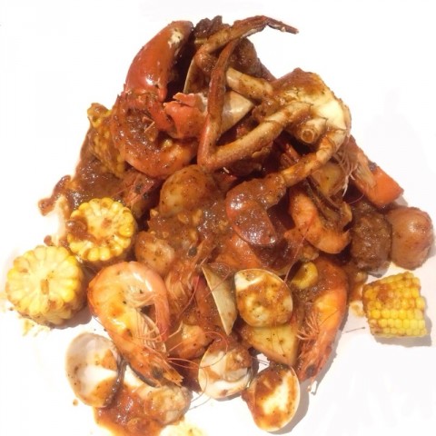 Sri Lankan crab, prawns, clams, potatoes, carrots, sausages & corn. Very worth it combo bag!!! Their signature mild sauce was just nice for me! It was still spicy but not spoiling the seafood taste!