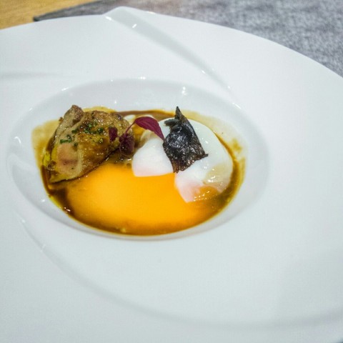With one hour poached egg, summer truffle, cepes reduction and shiso cress 