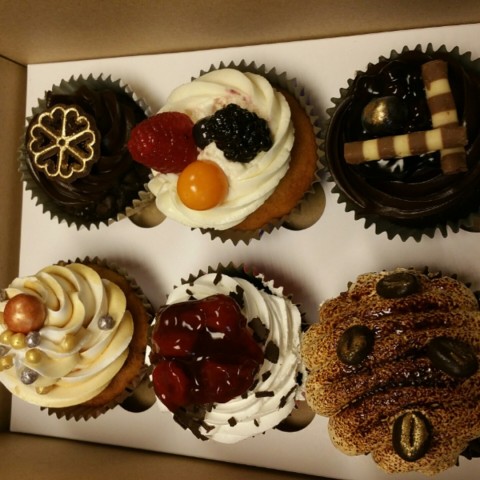 Pretty & assorted cupcakes that are not too sweet.