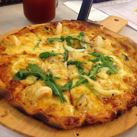 The seafood pizza was awesome, every mouth tastes cheesy good.